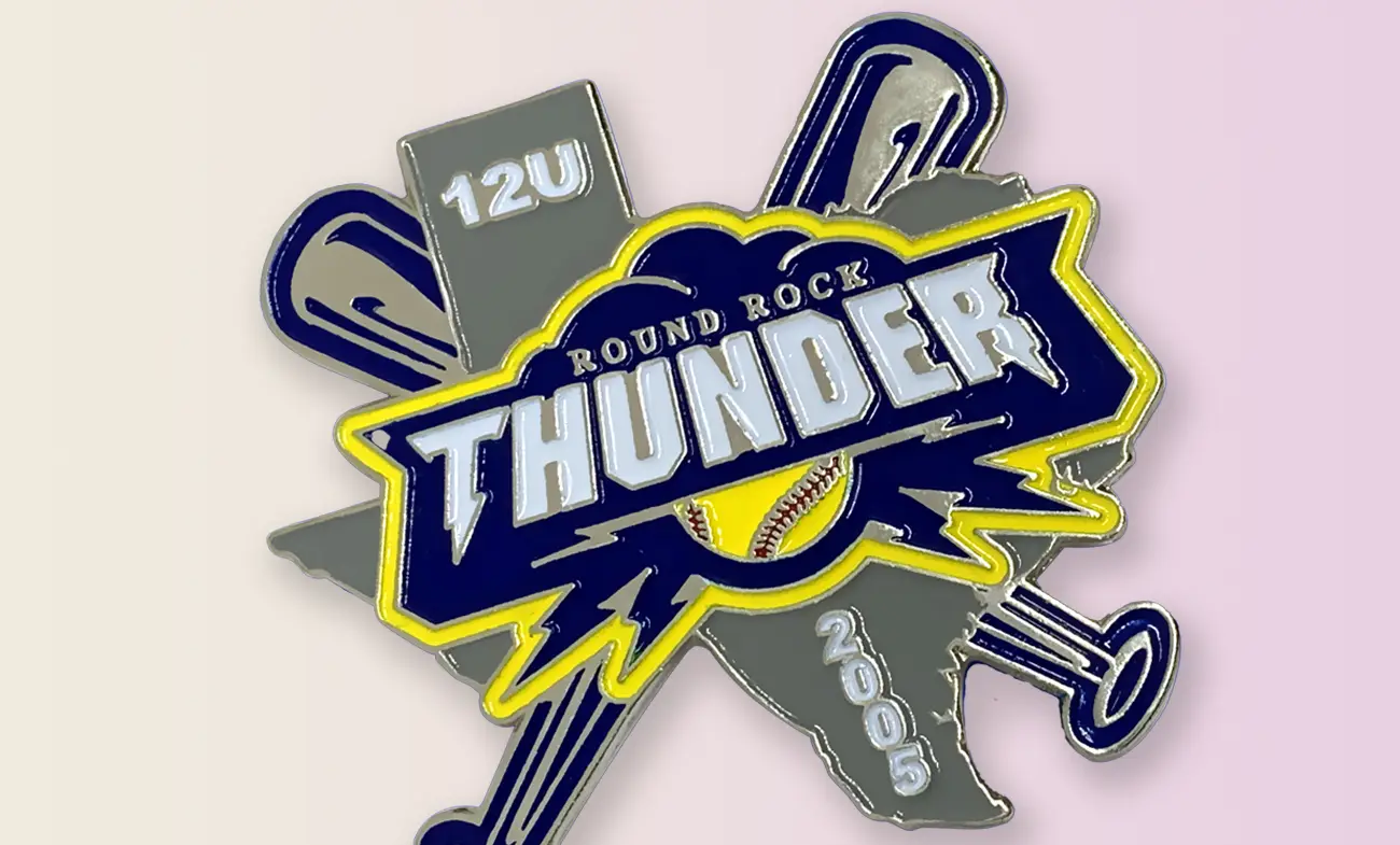 A softball trading pin from 2005 that we've made.